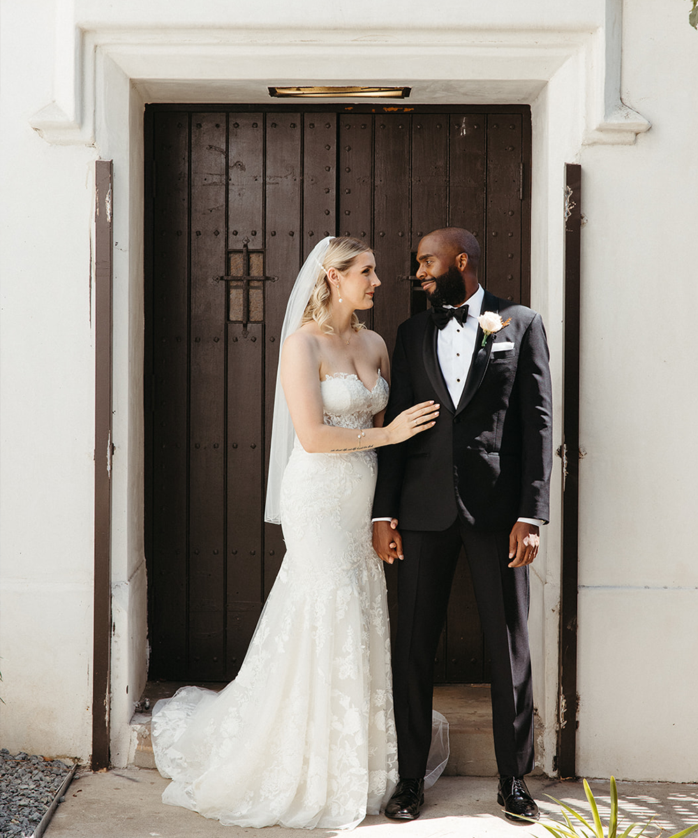 Couple by doors - The Sanctuary by Wedgewood Weddings