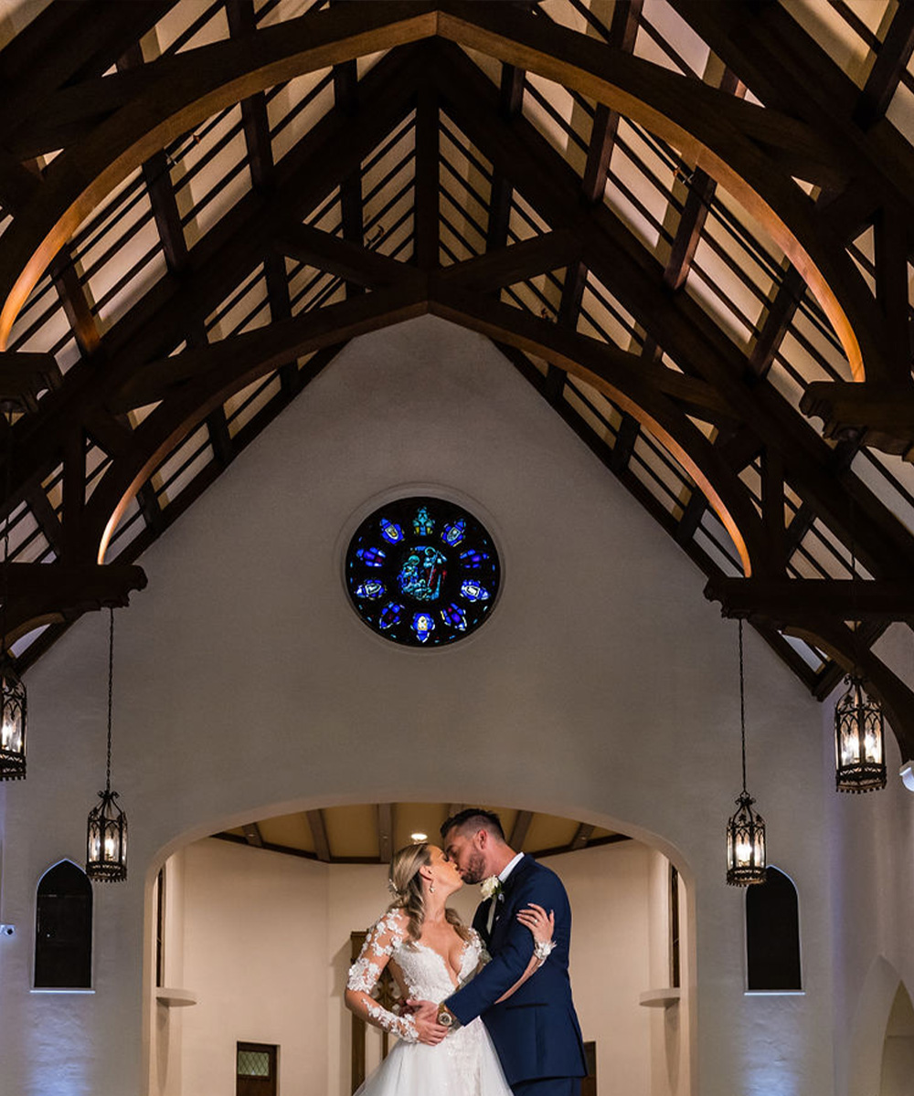 Couple kissing inside The Sanctuary by Wedgewood Weddings