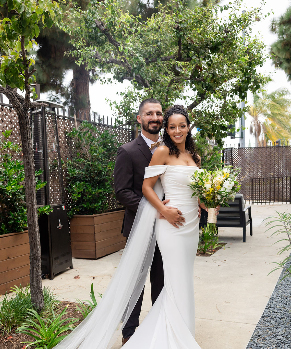 Couple outside by greenery - The Sanctuary by Wedgewood Weddings