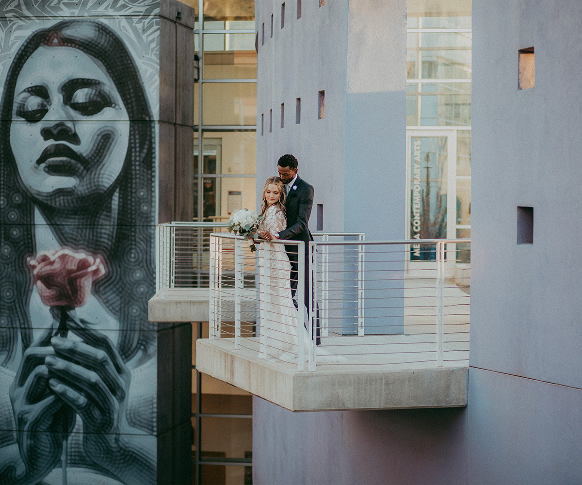 Couple in downtown Mesa with mural - Tre Bella by Wedgewood Weddings