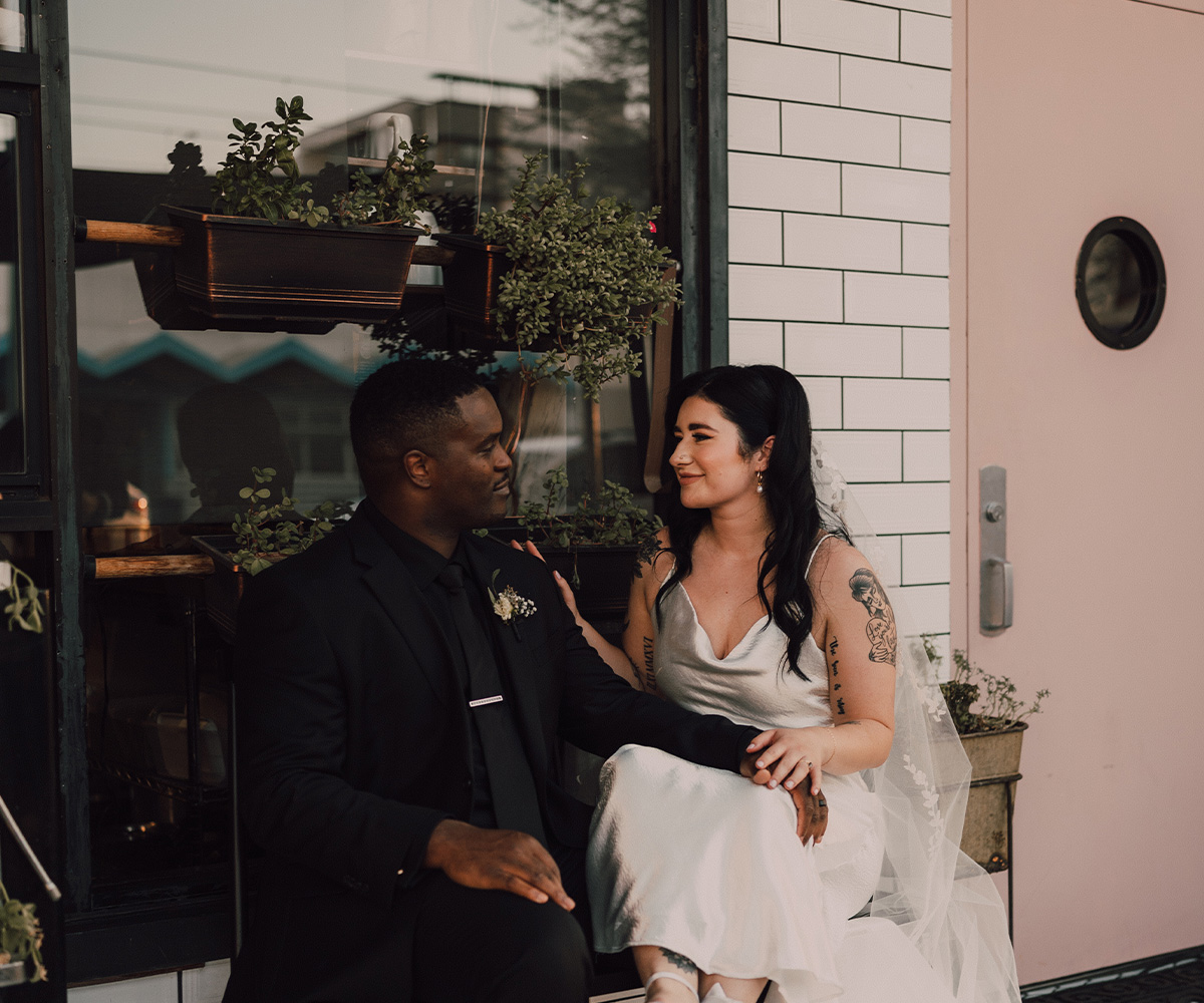 Couple in front of coffee shop in downtown Mesa - Tre Bella by Wedgewood Weddings