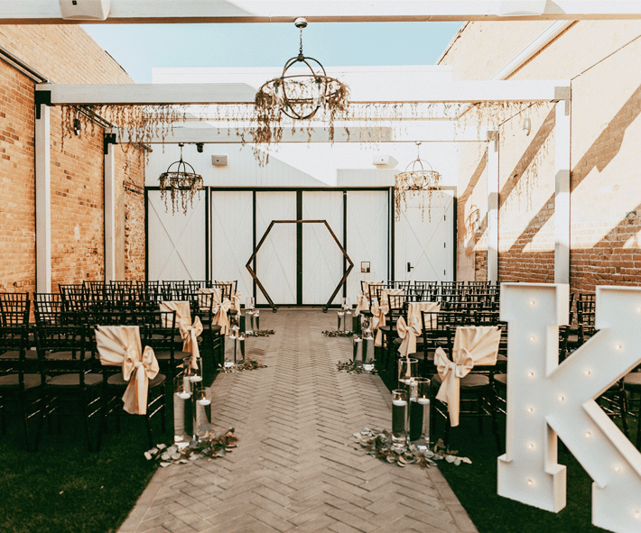 Courtyard ceremony with decor at Tre Bella