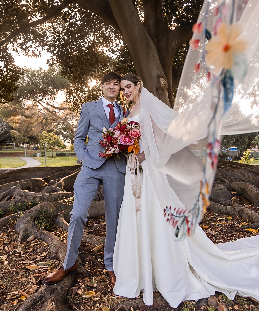 Couple in front of large tree at University Club