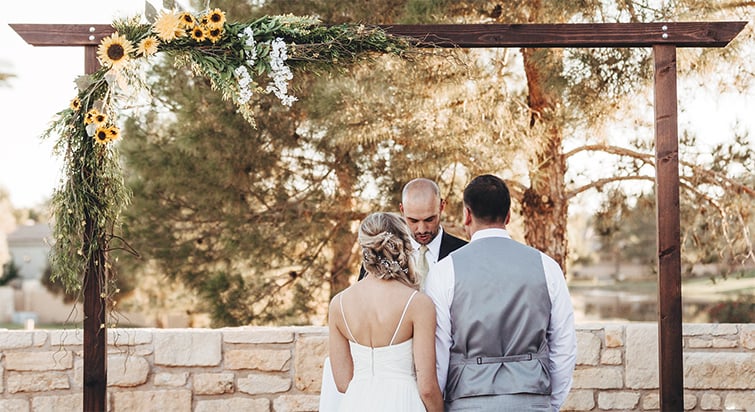 A Couple Exchange Vows In Front Of Their Officiant At Ocotillo Oasis By Wedgewood Weddings