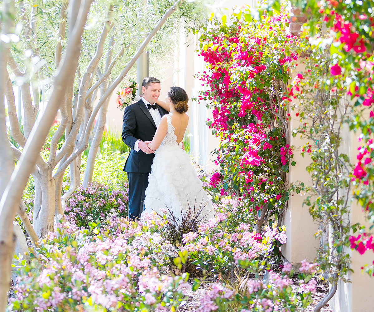 27-Aliso Viejo by Wedgewood Weddings Posing by the Flowers