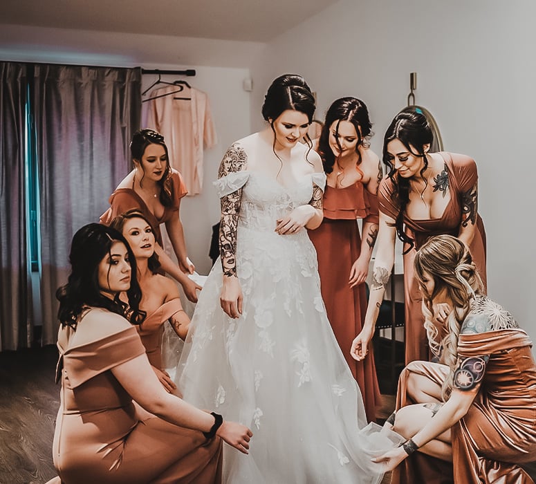 Getting Ready in Her Wedding Gown at Granite Rose by Wedgewood Weddings