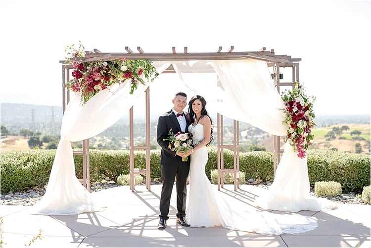 Beautiful Flowing Wedding Arbor Decor by Flower Divas