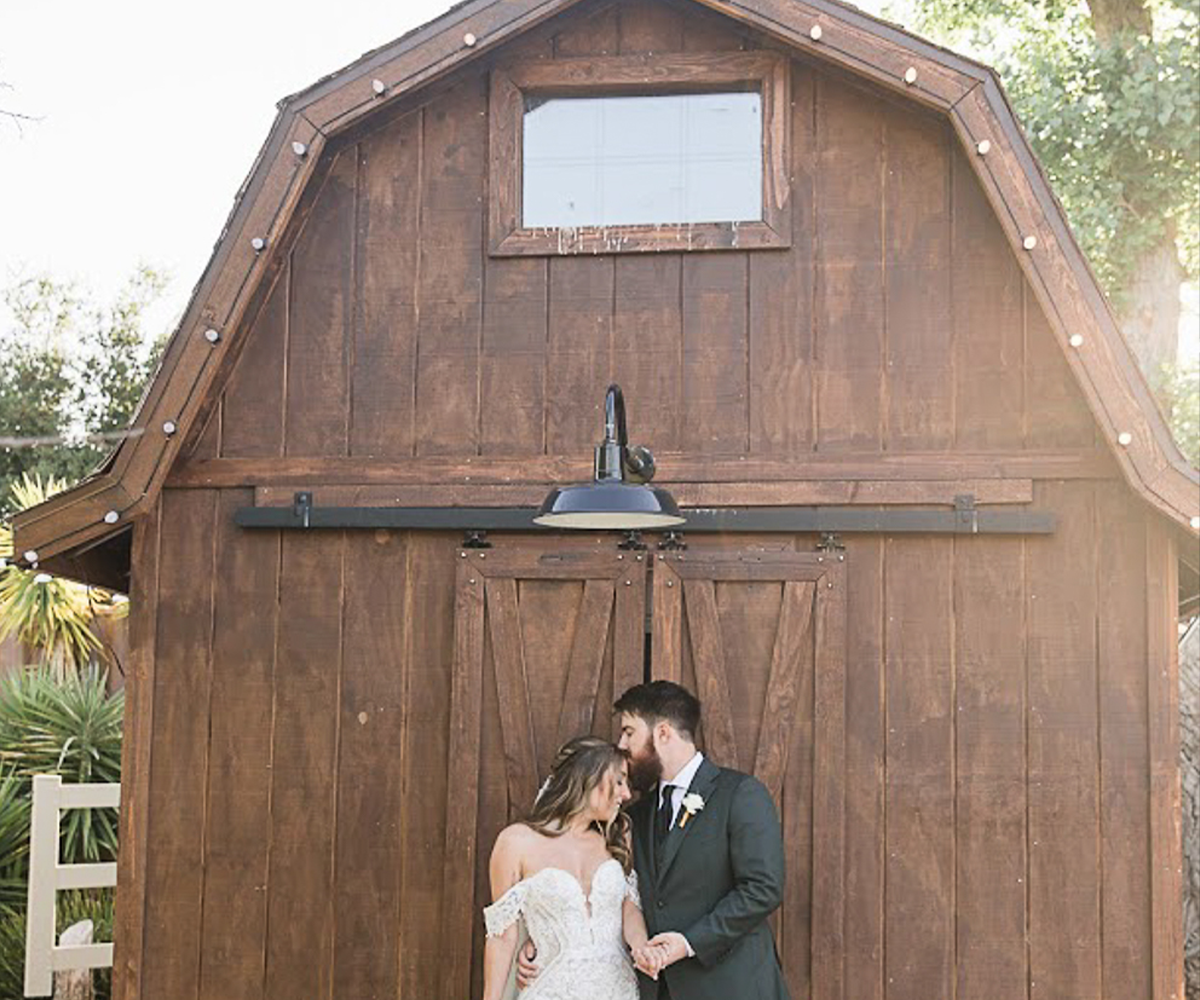 Couple by barn- Bel Vino Winery by Wedgewood Weddings