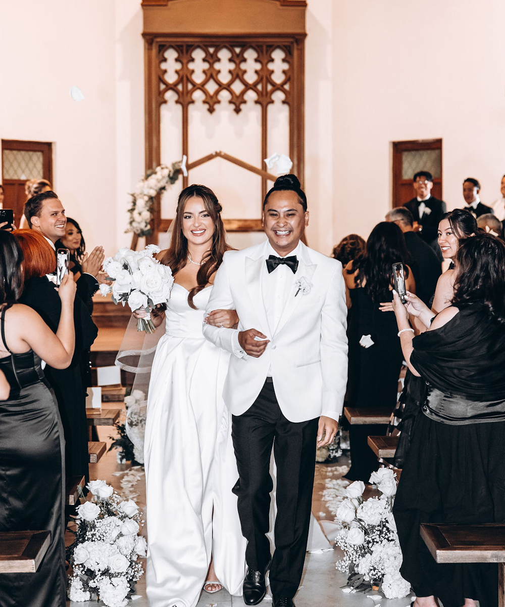 Couple exiting ceremony - The Sanctuary by Wedgewood Weddings