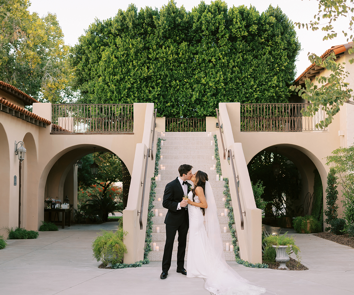 Couple in front of dramatic staircase at Secret Garden.jpg
