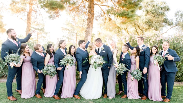The bridal party wore navy blue suits combined with flowing lavender dresses