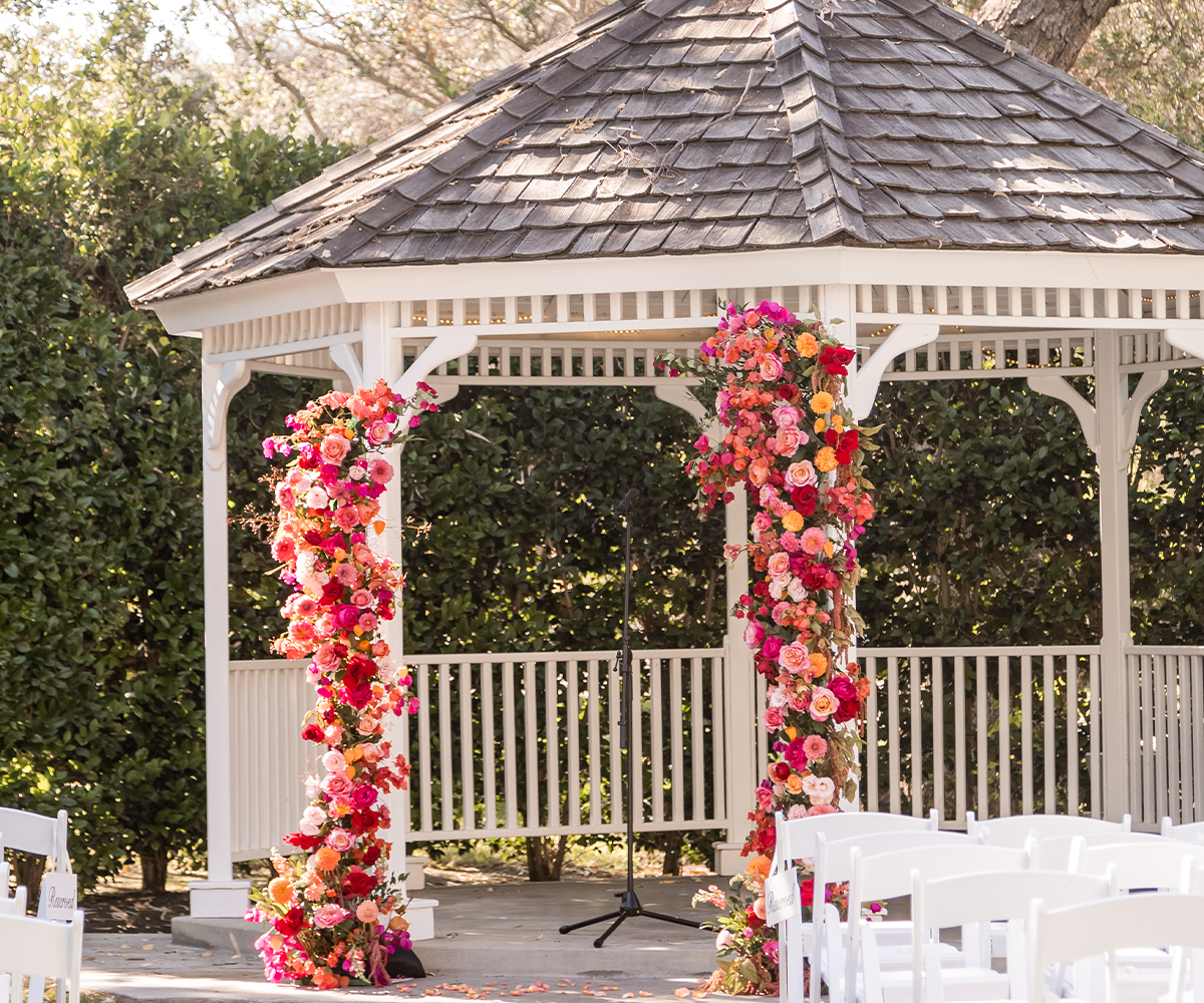 Gazebo with bright flowers at University Club by Wedgewood Weddings