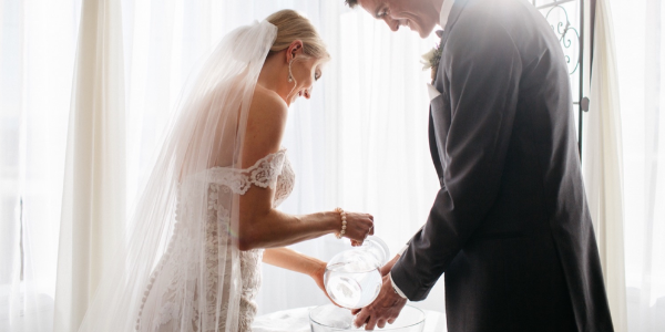 This is a modern twist on the traditional foot-washing ceremony. This ritual represents caring for one another and being of service. It also can be seen as a way of cleansing and preparing for your new life ahead. All you'll need is a table, water basin, pitcher, water, and towels. We love the deep symbolism of this ceremony and the easy clean-up!