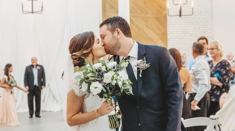 Jamie & Cody's celebratory kiss as newlyweds | The Carlsbad Windmill | Focus On Love Photography