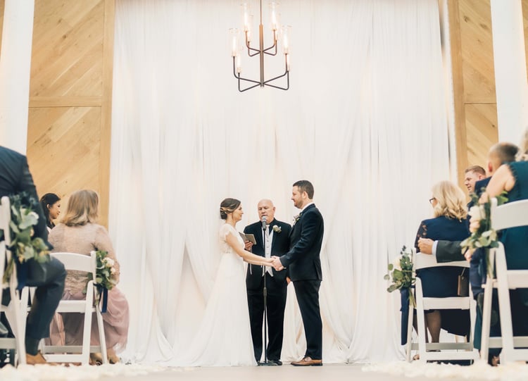 the heartfelt vows echoed perfectly in the stunning modern cathedral | The Carlsbad Windmill | Focus On Love Photography