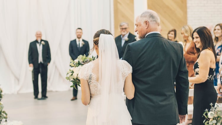 Jamie walks down the aisle full of loved ones with her dear father | The Carlsbad Windmill | Focus On Love Photography