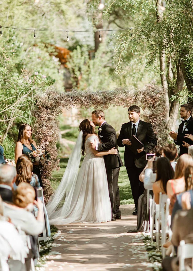 What do you envision when you imagine a romantic celebration of love in the woods alongside a babbling creek? Chances are it'll look something like this beautiful wedding at Boulder Creek by Wedgewood Weddings. Think secret-garden vibes, romantic nature-inspired color palette, lavish greenery, roses, and wandering wildlife. Oh, and dinosaurs! Join us for a virtual tour of Katie and Robert's wedding story . . .