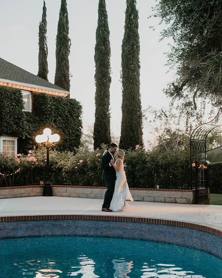 A Romantic poolside first dance at sunset