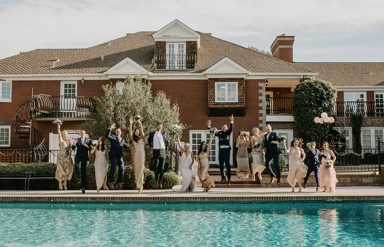 These playful jumping photos in front of the manor's pool turned out priceless
