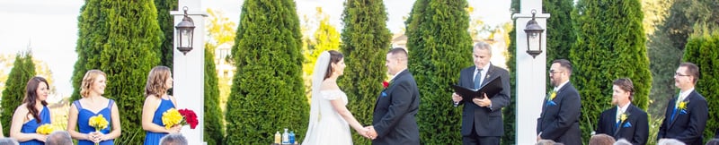 Michelle and Matt saying their vows at Eagle Ridge by Wedgeowod Weddings