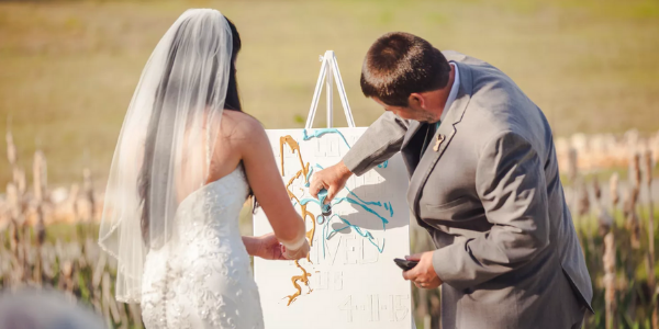 A painted canvas is the perfect way to add a splash of color to your ceremony, all while creating a keepsake that is truly unique. In this fun unity ceremony, each person selects a different paint color to pour onto a blank canvas. This option is great for creative couples who cherish art, history, and playfulness.