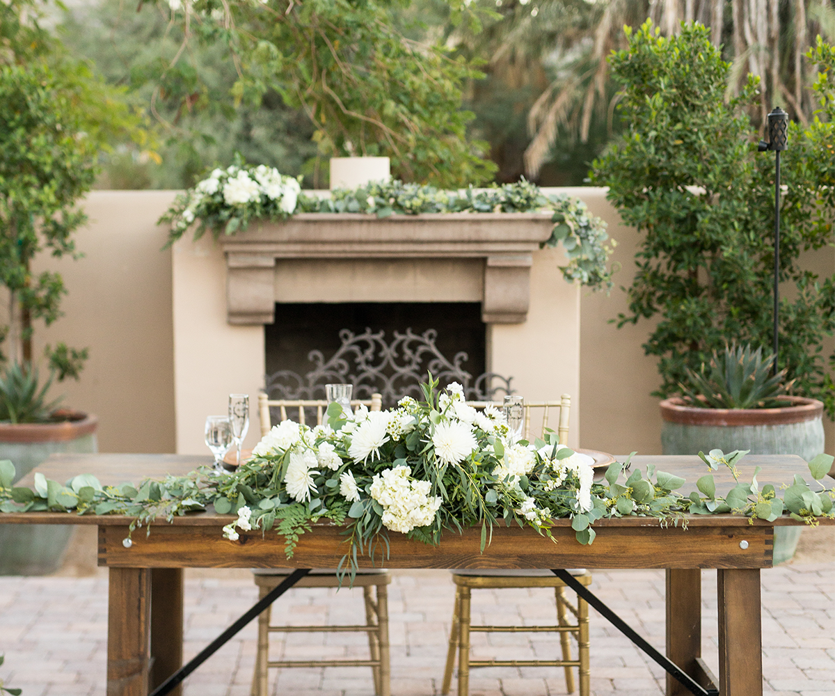 Sweetheart table in front of fireplace - Secret Garden