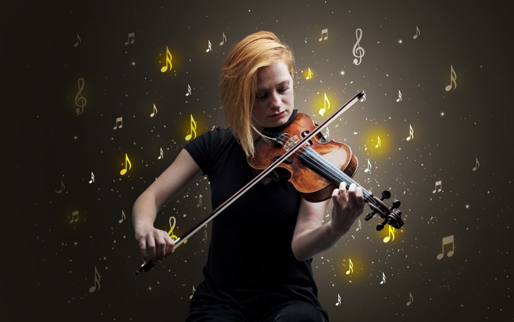 Young violinist with falling musical notes wallpaper and classical concept