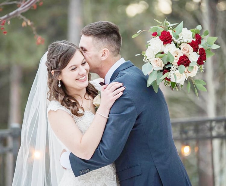 Happy Newlyweds Embrace at Black Forest by Wedgewood Weddings