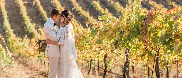 Bel Vino Winery by Wedgewood Weddings - Couple Kissing in Vineyard