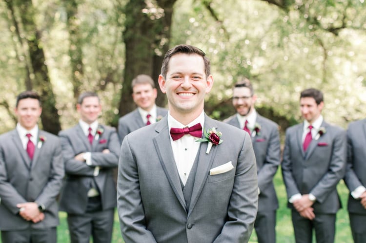 Handsome groom with maroon bowtie at Boulder Creek