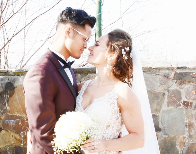 Julia and Jesse pose for bridal portraits in the snow-covered gardens at Granite Rose
