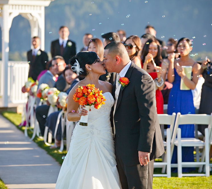 Bride-and-Groom-with-guests-in-background