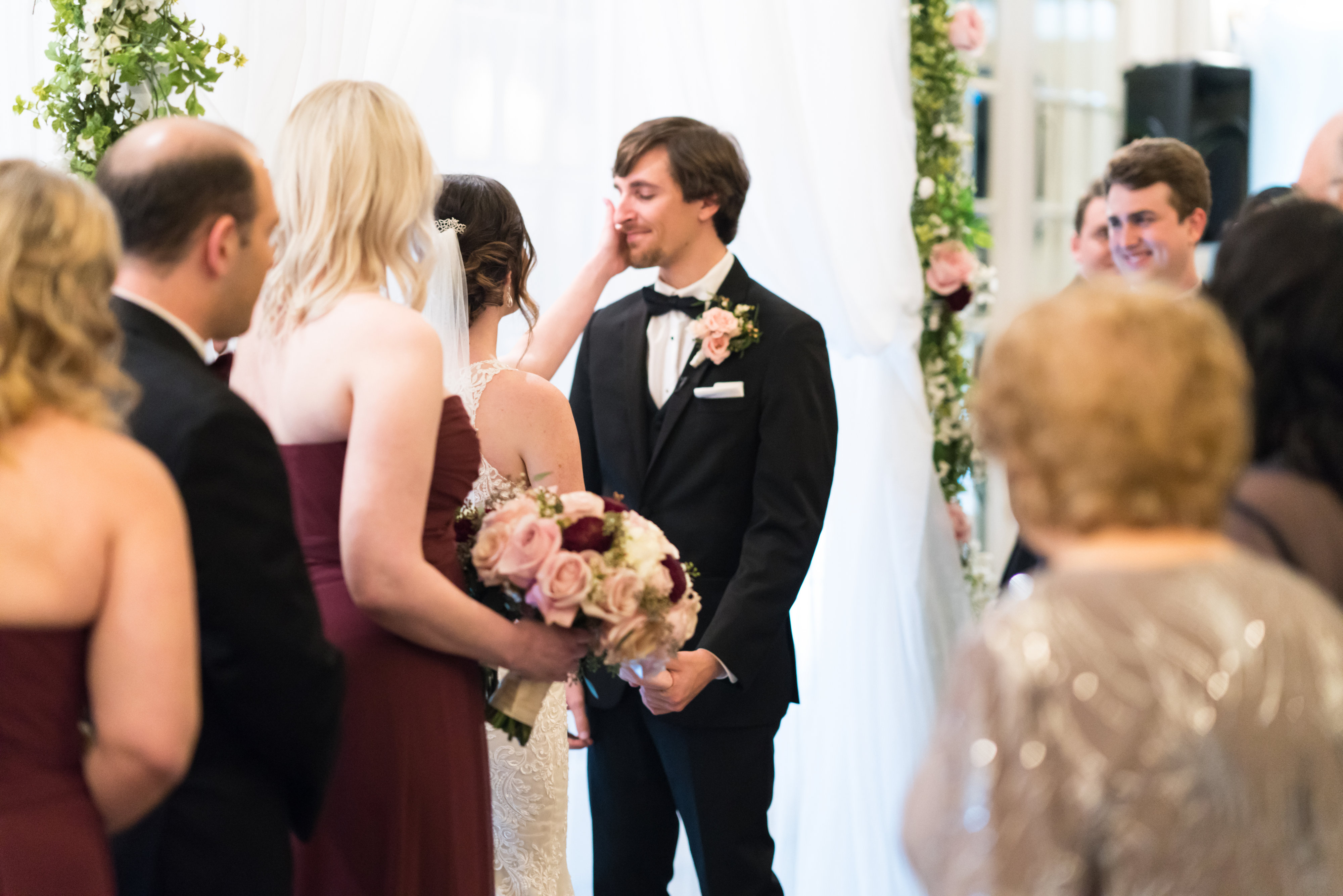 a groom sheds tears of joy at the wedding ceremony