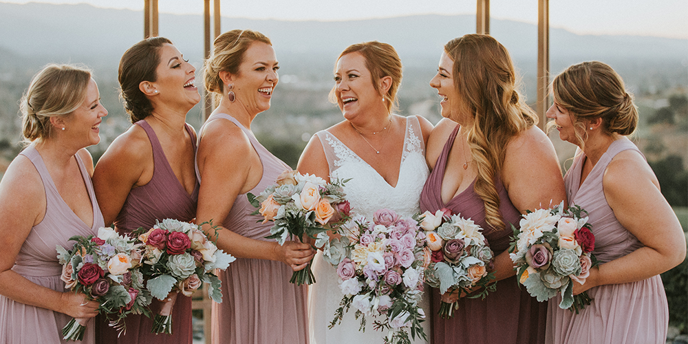 https://www.wedgewoodweddings.com/hubfs/3.0%20Feature%20Images%201000%20x%20500%20px/Blog/BoulderRidge-BridalParty-API-PamelaMatt-2019-WedgewoodWeddings%20%2824%29.png#keepProtocol