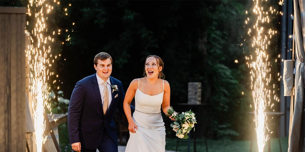 Couple enjoying the grand sparkler moment at Boulder Creek by Wedgewood Weddings