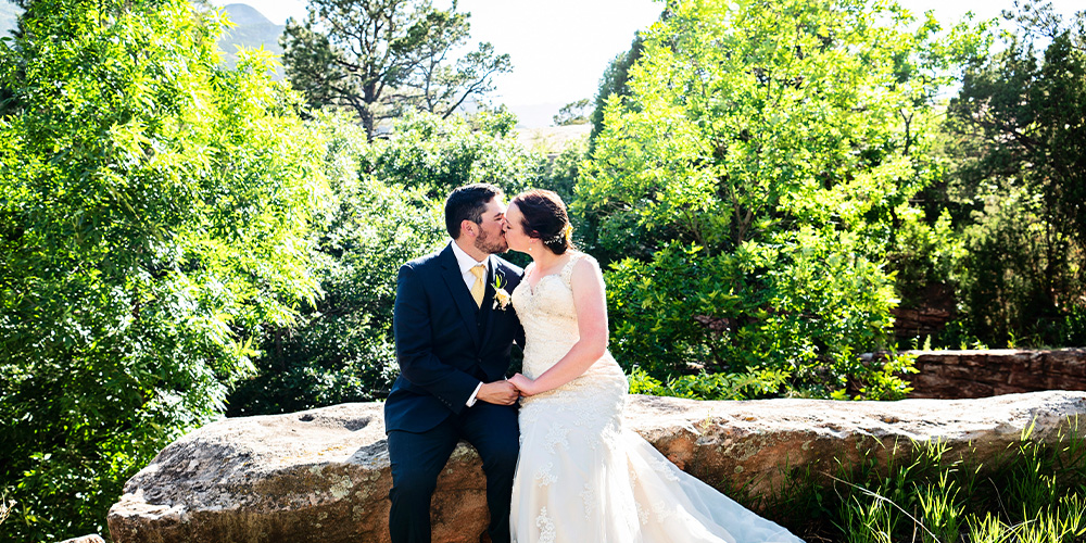 Couple kissing at Craftwood Peak by Wedgewood Weddings
