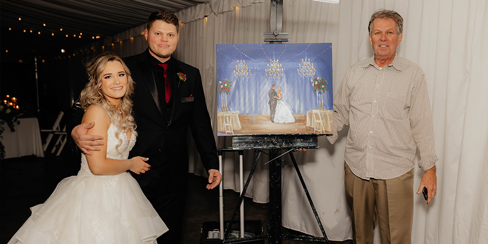Couple with live painter at reception - Stonebridge Manor by Wedgewood Weddings