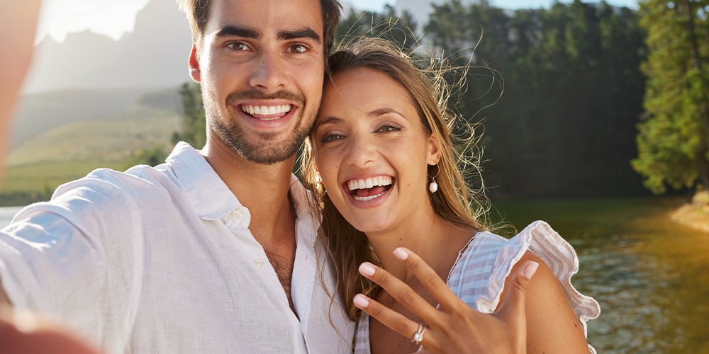 Couple showing off their engagement