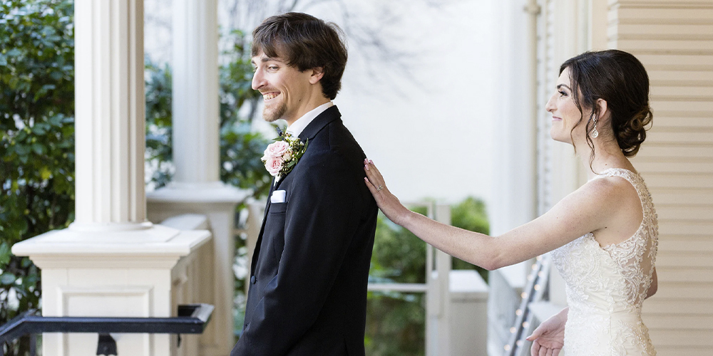 a bride and groom doing a first look