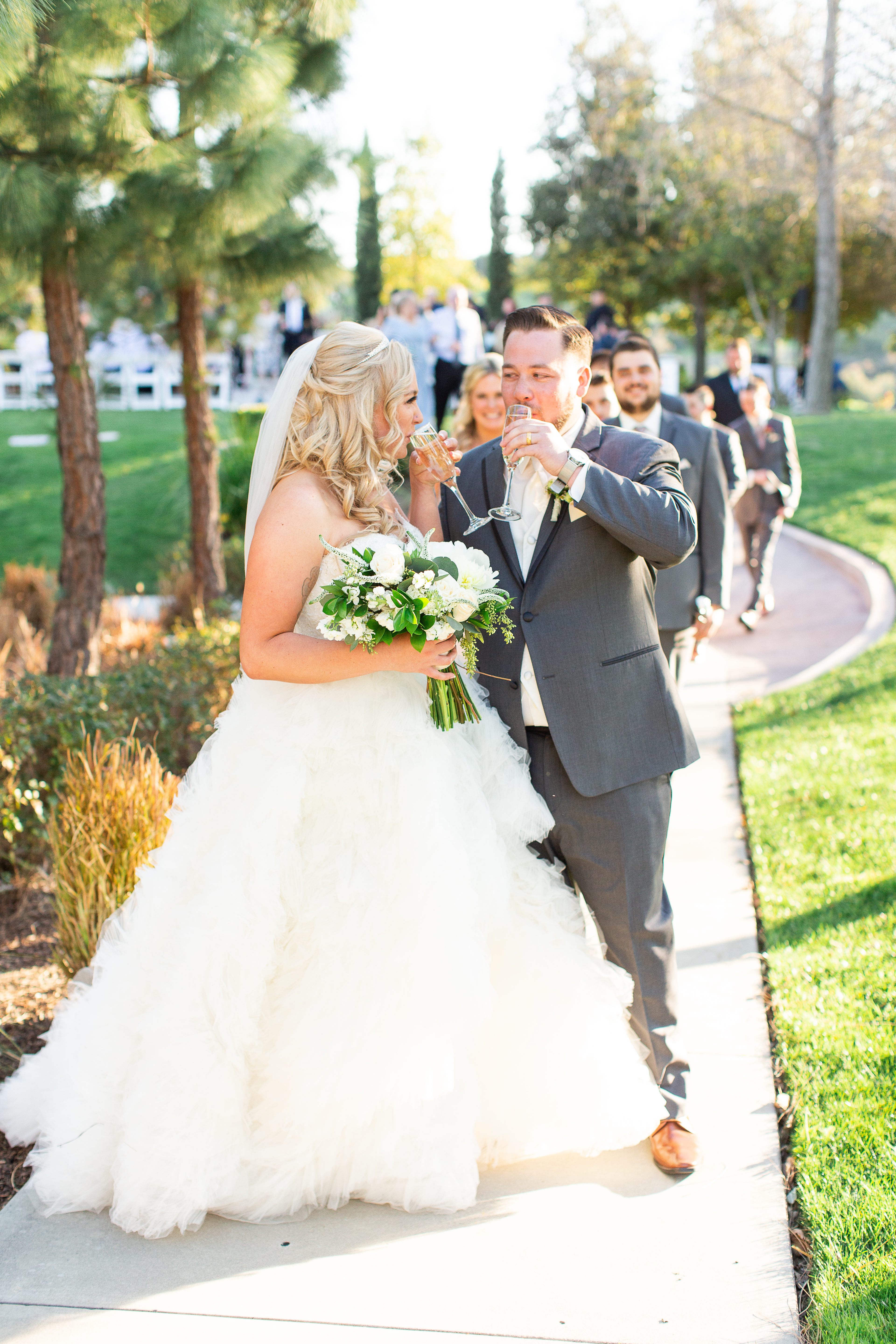 newlyweds toast at Vellano Estate