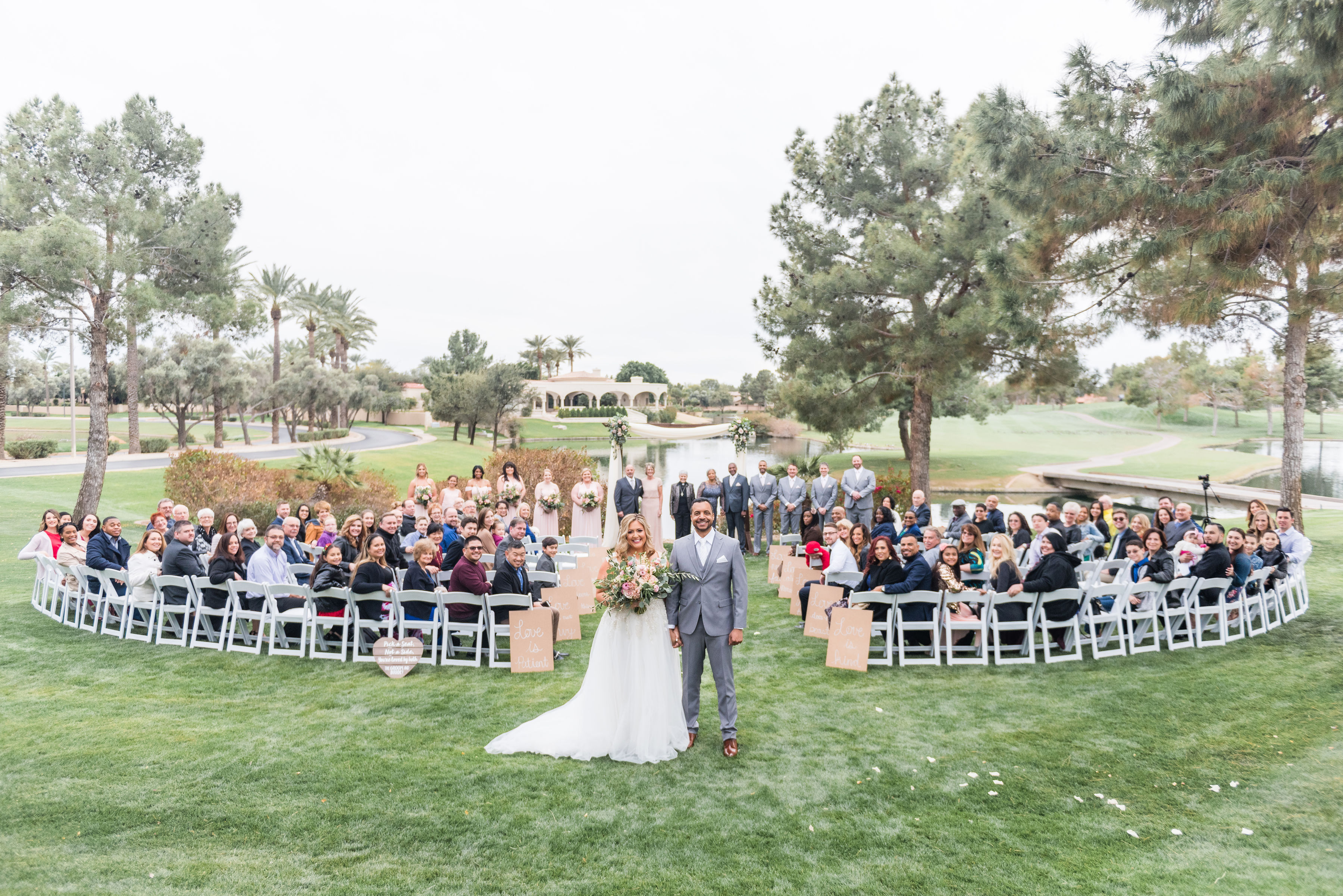 newlyweds in front of the lower garden outdoor wedding ceremony site at Ocotillo Oasis