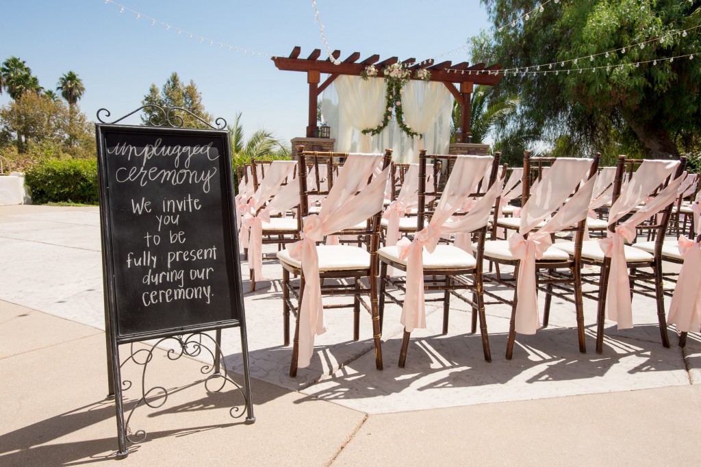 outdoor wedding chair decor pink sash chalkboard sign