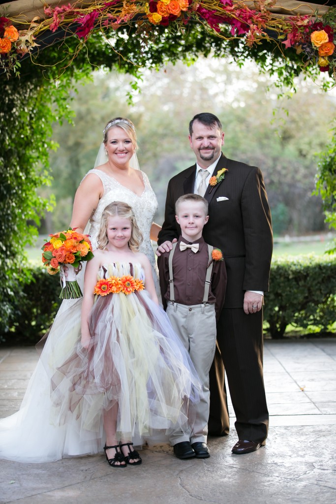 fall wedding bride and groom with kids family photo