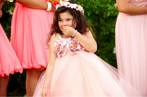 flower girl smiling in pink tulle dress