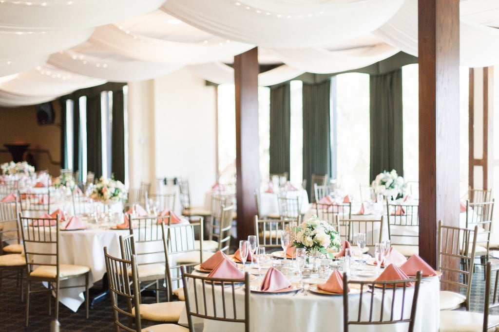 dusty rose wedding seating arrangement and floral centerpiece