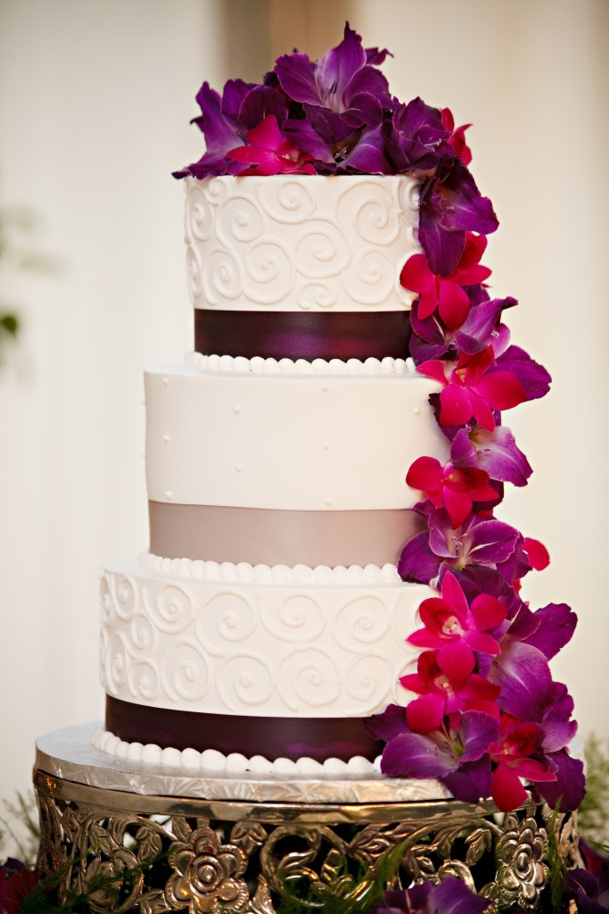 wedding cake with cascading fresh flowers