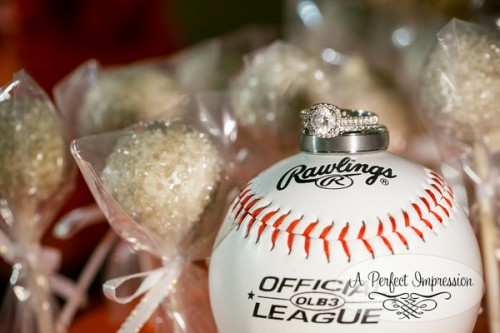 baseball sports themed wedding with rings on baseball