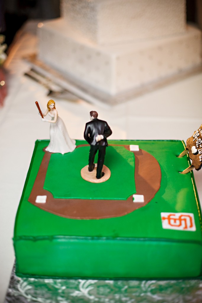 sports themed wedding cake with bride and groom playing baseball